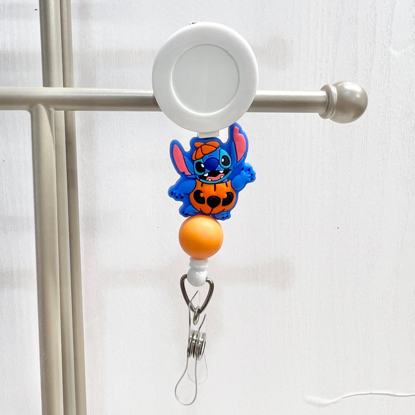 Pumpkin Blue Alien Badge Reel